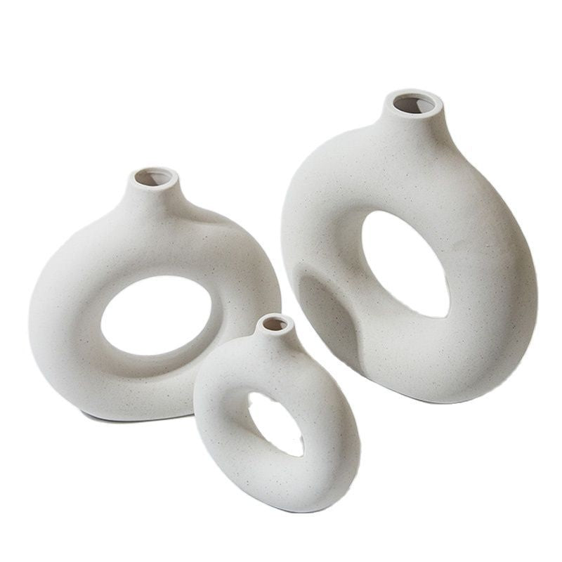 White ceramic donut vases in several sizes