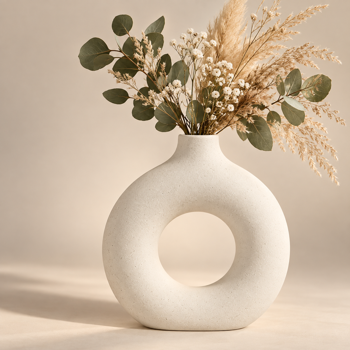 Forma white ceramic donut vase with dried flowers